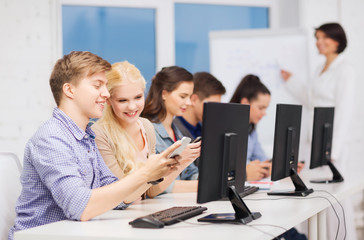 Wall Mural - students with computer monitor and smartphones