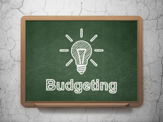 Wall Mural - Business concept: Light Bulb and Budgeting on chalkboard