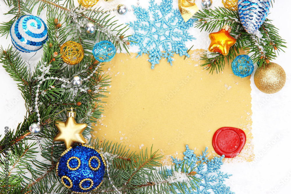 Frame with vintage paper and Christmas decorations close up