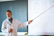 © lightpoet - Senior chemistry professor giving a lecture