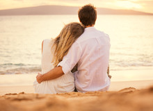 Young Couple In Love On The Beach Sunset