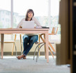 © Tyler Olson - Portrait Of Student Sitting In Library