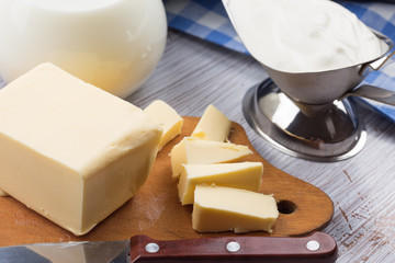 Fresh butter on wooden board.