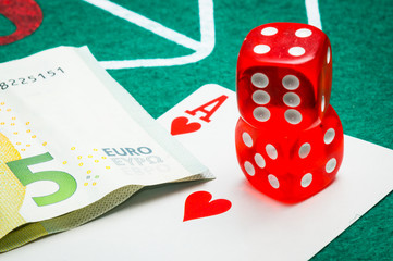 two red dice with euros