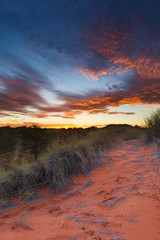beautiful kalahari sunset with dramatic clouds and grass