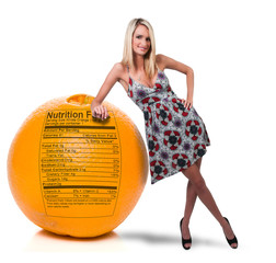 Wall Mural - Woman Leaning on Orange with Nutrition Label