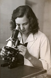 Fototapeta Młodzieżowe - girl with the microscope - photo scan - about 1950
