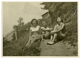 Fototapeta Młodzieżowe - Two girls are sunbathing in the sun - circa 1950