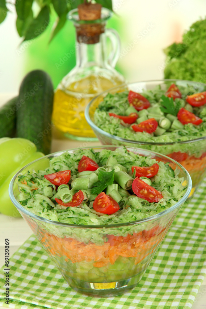 Tasty salad with fresh vegetables on wooden table