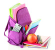 Purple backpack with school supplies isolated on white