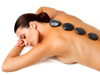 Wall Mural - Stone Massage. Beautiful Woman Getting Spa Hot Stones Massage