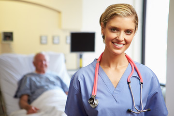 Wall Mural - Portrait Of Female Nurse With Patient In Background