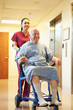 © Monkey Business - Senior Male Patient Being Pushed In Wheelchair By Nurse