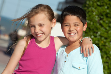 portrait of two little friends outdoors