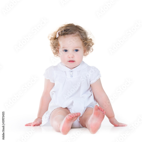 Beautiful Baby Girl With Curly Hair Wearing A Nice White Dress O