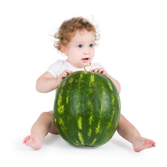 Funny little baby with a big watermelon, on white background