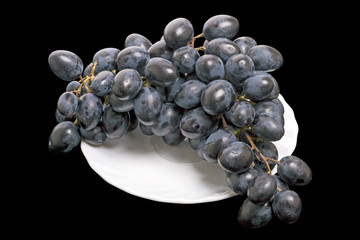 Wall Mural - Dark grapes on a white plate