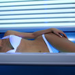 woman sunbathing in the solarium