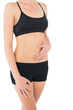 © lightwavemedia - Close-up mid section of a fit woman in black sportswear