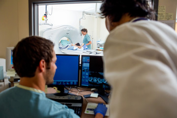 Wall Mural - Medical Team Operating Computers In CT Scan Lab