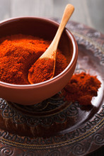 red paprika powder spice in bowl