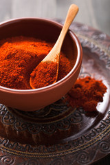 Wall Mural - red paprika powder spice in bowl