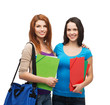 © Syda Productions - two smiling students with bag and folders