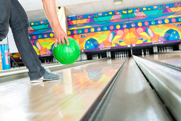 Young man bowling having fun