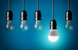 © chones - Glowing LED bulb and simple light bulbs