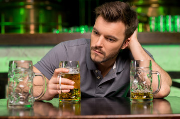 Wall Mural - Lonely man in bar.