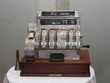 Vintage cash register on the table front view