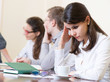 © spass - Tired business woman with headache at seminar