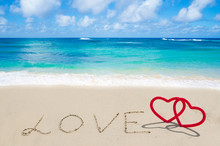 Sign "LOVE" With Hearts On The Beach