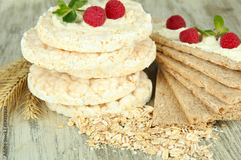 Tasty crispbread with berries, on wooden table