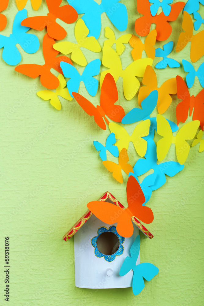 Paper butterflies fly out of nesting box