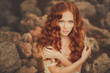 © GTeam - Portrait of young beautiful redhair woman standing in green park