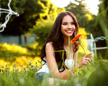Beautiful Girl With Red Flower. Beautiful Model Woman Face.