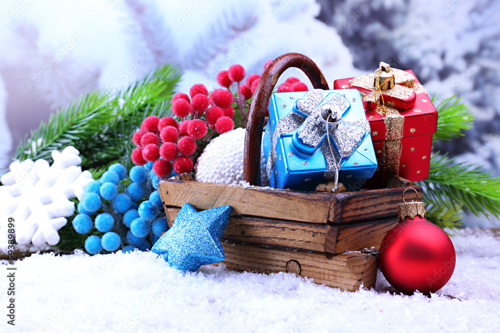 Composition with Christmas decorations in basket, fir tree