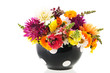 Colorful bouquet garden flowers in black vase