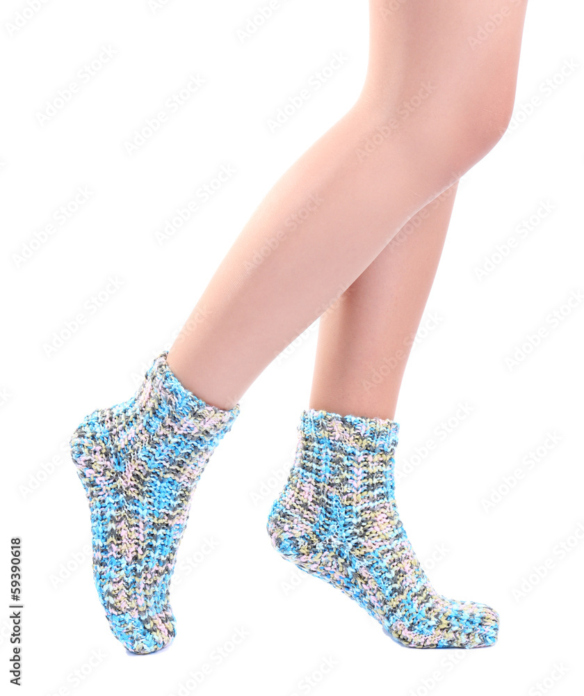Female legs in colorful socks, isolated on white