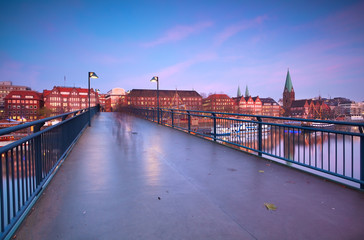 Fototapete - view on sunset over Bremen city from bridge