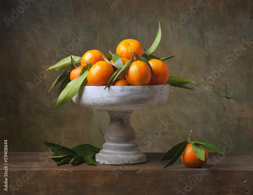 Tapeta ścienna na wymiar Vintage still life with tangerines in vase for fruits