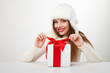 © julenochek - smiling woman with gift box over light background