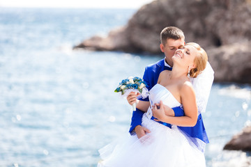 wedding: bride and groom on the seashore