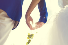 Wedding Couple Hands Touching Fingers In The Shape Of Hearts
