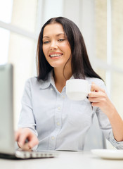 Canvas Print - smiling businesswoman or student with laptop