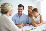 Fototapeta  - Family meeting real-estate agent for house investment