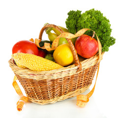 Fototapete - Fresh vegetables in wicker basket isolated on white