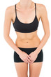 © lightwavemedia - Mid section of a fit woman in black sportswear