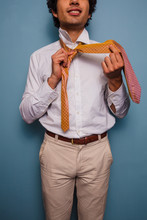 Young Man Tying His Tie